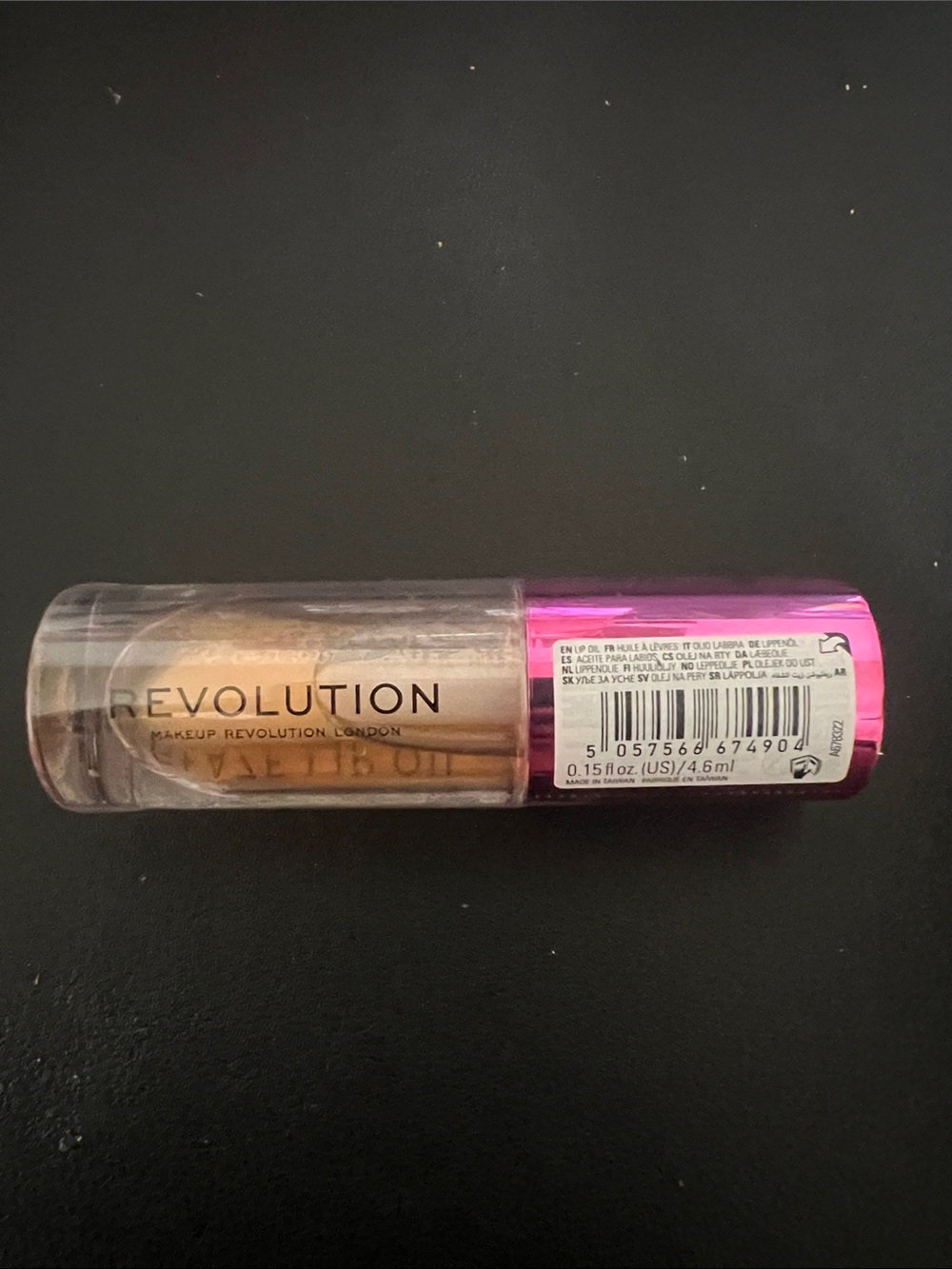 Revolution Metallic Gold Lip Oil with Pink Cap
